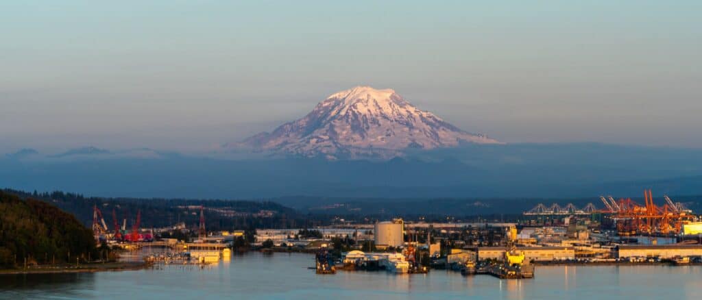 Overhead shot of Tacoma, Washington with Mount Rainer featured prominently in the background.